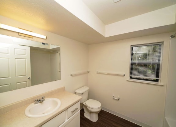 a renovated bathroom with a window  at Arbor Lakes Apartments, Elkhart, IN, 46516