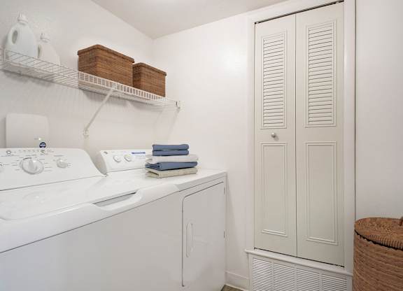 A laundry room with a full-size washer and dryer at Autumn Lakes Apartments and Townhomes, Mishawaka, 46544