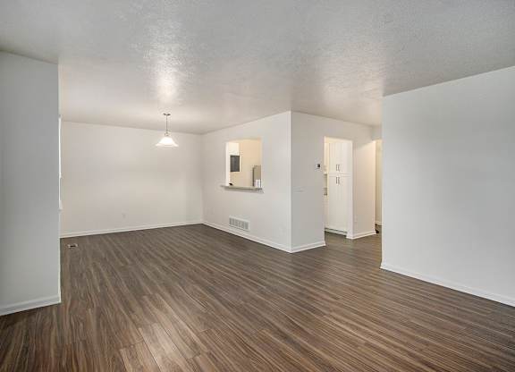 A room with wooden flooring and white walls at Autumn Lakes Apartments and Townhomes, Mishawaka, 46544
