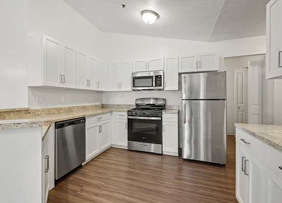 A kitchen with white shaker cabinets and stainless steel appliances at Autumn Lakes Apartments and Townhomes, Mishawaka, 46544