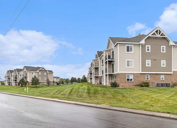 A large apartment complex with multiple buildings and green lawns at Autumn Lakes Apartments and Townhomes, Mishawaka, IN