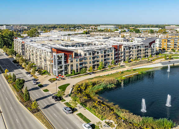 an aerial view of a city with a lake and buildings at Avant & Avant II, Carmel, IN, 46032