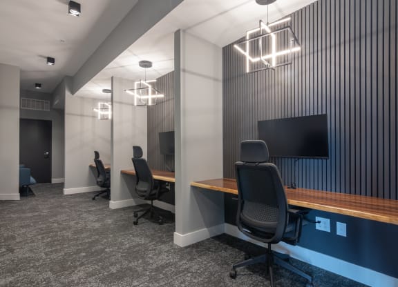 remote work spaces with chairs and TVs in Carmel, IN