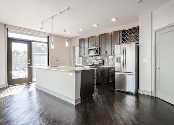 a kitchen with a large island and stainless steel appliances at Avant & Avant II, Carmel, IN, 46032