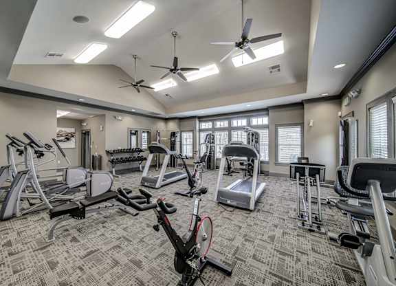 a gym with treadmills and other exercise equipment at the enclave at university crossings at Avellan Springs Apartments, Morrisville, North Carolina