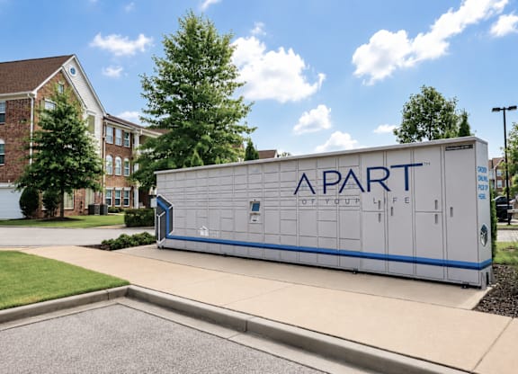 A white and blue trailer with the words Apartment Life on it.