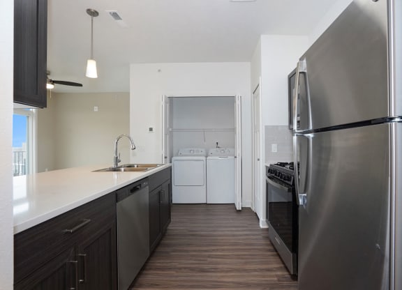 Kitchen with Washer & Dryer at Meadowbrooke Apartment Homes in Kentwood, MI 49512