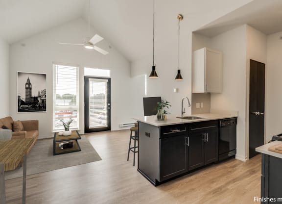a kitchen and living room in a 555 waverly unit  at Uptown Square Apartments, Troy, MI, 48083