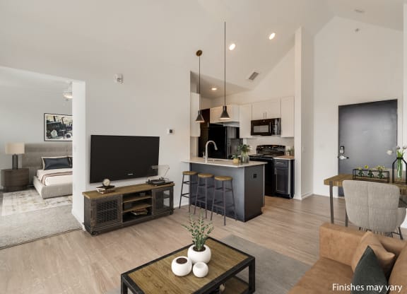 a view of the living room and kitchen from the dining area  at Uptown Square Apartments, Troy, MI