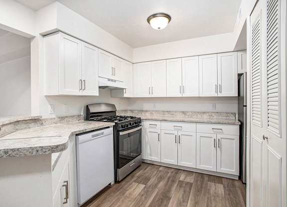 An upgraded kitchen with white cabinets at Brentwood Park Apartments, La Vista, 68128