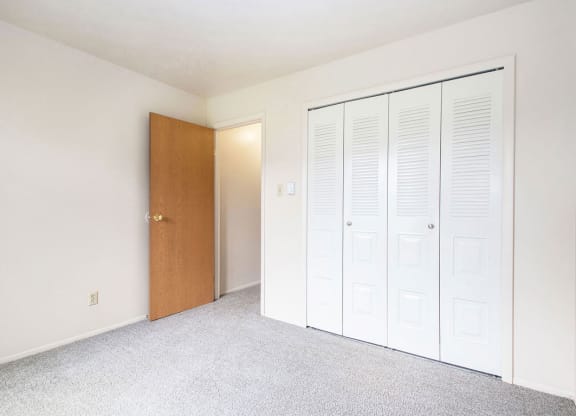 Bedroom with plush carpeting at Briarwood Apartments, Benton Harbor, Michigan