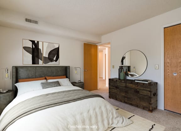 a bedroom with a large bed and a dresser with a mirror at Brook Pines, Columbia, SC, 29210