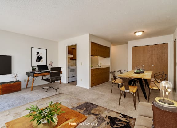 a living room and dining area with a desk and chairs and a flat screen tv  at Brook Pines, Columbia, SC