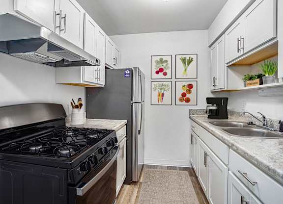 A kitchen with stainless steel appliances at Brookside Apartments, Springfield