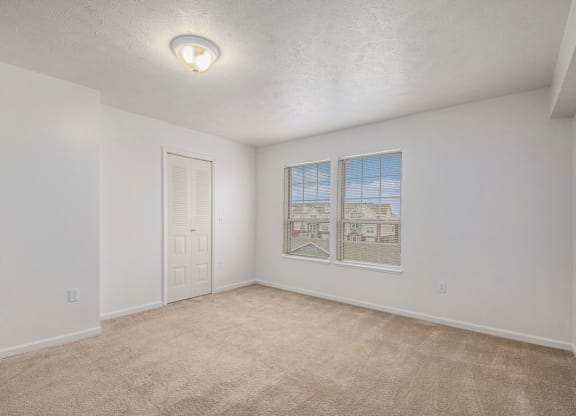 Spacious bedroom with large windows  at Black Sand Apartment Homes, Lincoln, NE