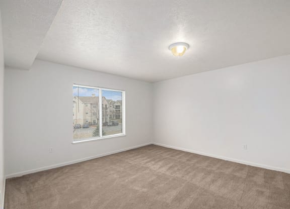 spacious bedroom with a large window  at Black Sand Apartment Homes, Lincoln, NE