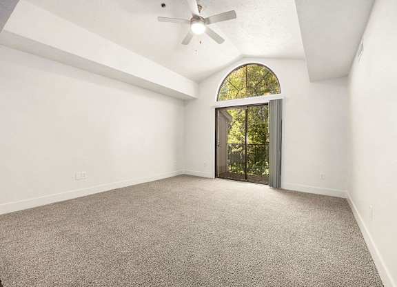 living room with plush carpeting at Byron Lakes Apartments, Byron Center