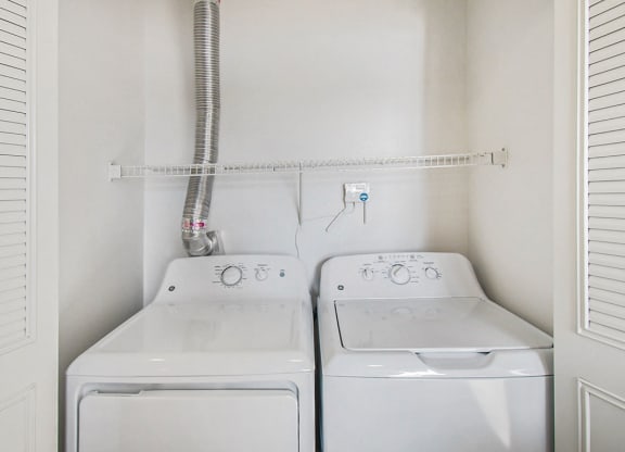 washer and dryer in the laundry room at Canal 2 Apartments, Lansing, Michigan