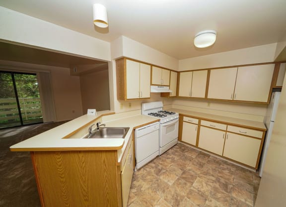 Well Equipped Kitchen at Canal Club Apartments in Lansing, MI