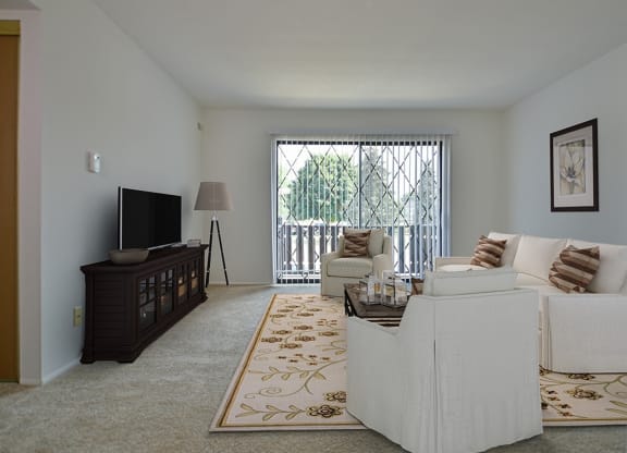 Living Room With Television at Charter Oaks Apartments, Davison