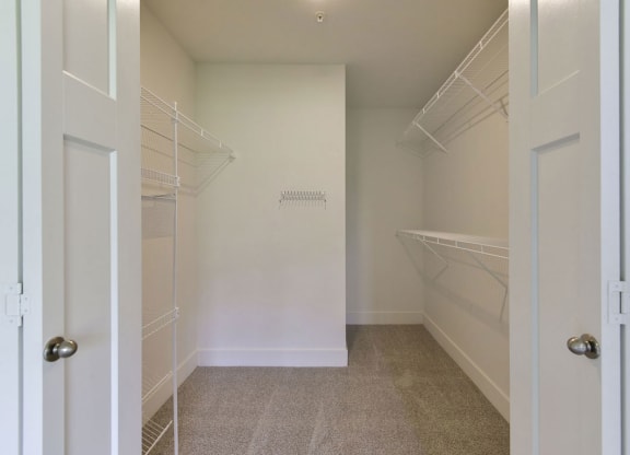 a walk in closet in an apartment home bedroom at Chase Creek Apartment Homes, Huntsville