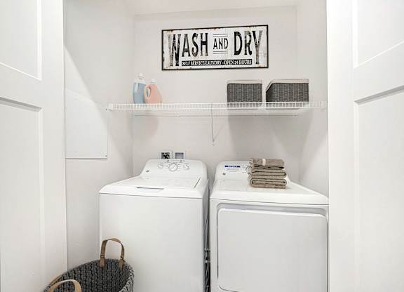 A laundry room with a washer and dryer at Chase Creek Apartment Homes, Huntsville, AL, 35811