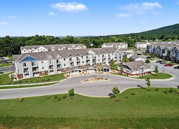 An aerial view of a modern apartment community with green grass at Chase Creek Apartment Homes, Huntsville, 35811