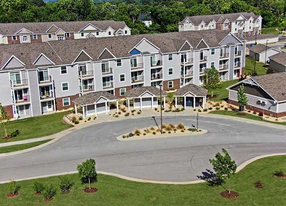 A large apartment complex with a central mail and package receiving area at Chase Creek Apartment Homes, Huntsville, 35811