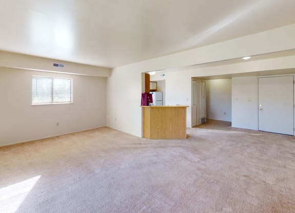 enlarged living room with extra window at Canal Club Apartments, Lansing, 48917