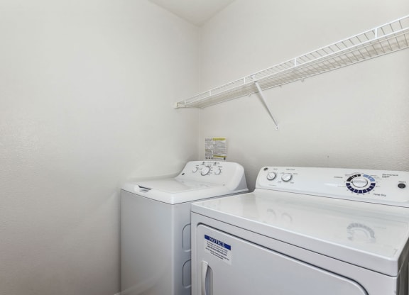 Laundry room with washer and a dryer at Colonial Pointe at Fairview Apartments, Bellevue, NE, 68123
