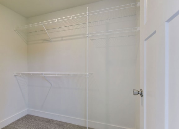 a large white walk-in closet with organizers at Copper Creek Apartment Homes, Maize, 67101