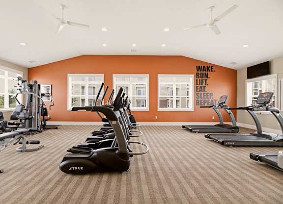 Fitness center with weight machines at Copper Creek Homes Apartments, Maize, KS