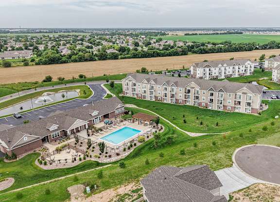 Aerial view of apartment community with pool and clubhouse at Copper Creek Homes Apartments, Maize, Kansas