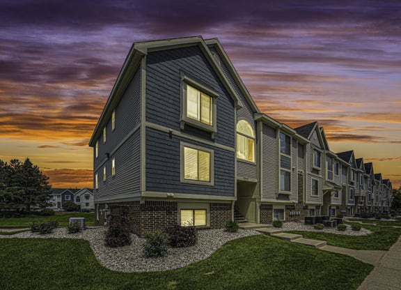 sunset view of apartment building at The Crossings Apartments, Michigan, 49508