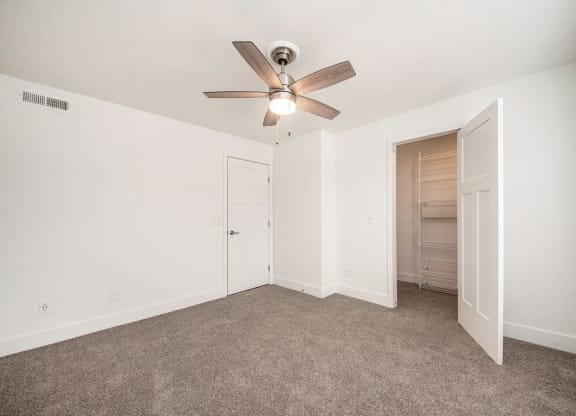 Large Walk In Closet with Wardrobe Organizers at The Crossings Apartments, Grand Rapids, Michigan