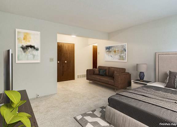 A bedroom with a large bed, a couch, and a painting on the wall.