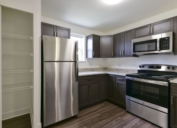 Kitchen with Window and Large Pantry at Dodson Pointe Apartment Homes, Rogers, AR, 72758