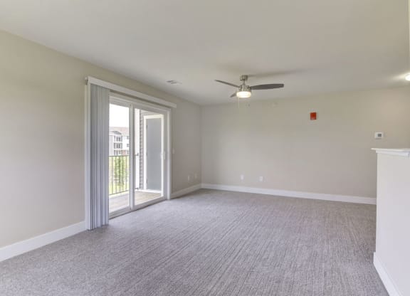 Huge Living Area to Private Balcony at Dodson Pointe Apartment Homes, Rogers, AR, 72758