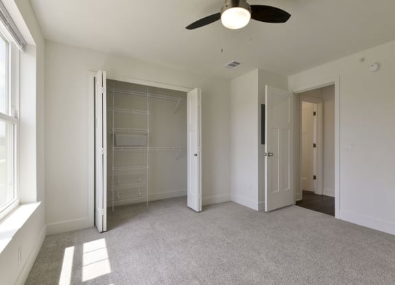 Walk-In Closet with Wardrobe Organizers at Dodson Pointe Apartment Homes, Rogers, AR, 72758