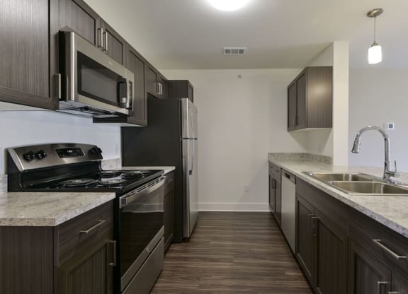 Two Bedroom Kitchen with Stainless Steel Appliances at Dodson Pointe Apartment Homes in Rogers, AR