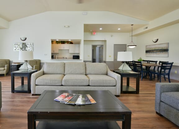 a living room with a couch and a coffee table at Heatherwood Apartments, Grand Blanc