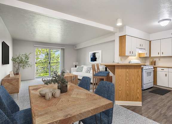 A modern kitchen with a dining table and chairs at Dupont Lakes Apartments, Fort Wayne