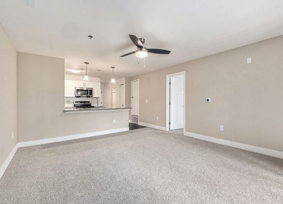 Two bedroom living room leading to modern kitchen at Eagle Ridge Apartment Homes, Traverse City, 49685