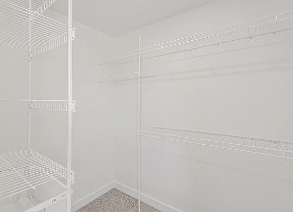 Large walk in closet with organizers at Eagle Ridge Apartment Homes, Traverse City, MI 49685