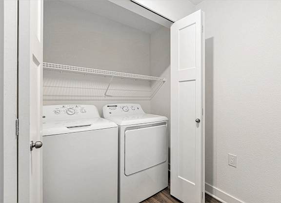 Laundry with full size washer and dryer at Eagle Ridge Apartment Homes, Traverse City