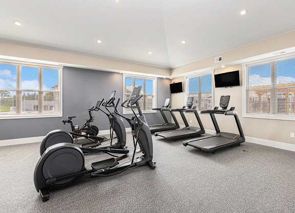 treadmills and TVs in fitness center at Eagle Ridge Apartment Homes,  Michigan 49685