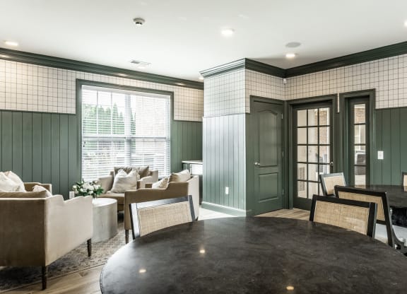 Tables and chairs in leasing center at Alexandria of Carmel Apartments, Carmel, Indiana
