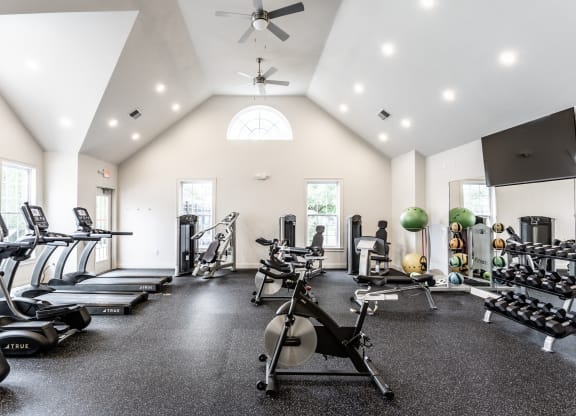 Fitness center with equipment at Alexandria of Carmel Apartments, Indiana