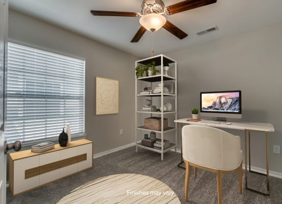 an office with a computer and a desk with a chair  at Killian Lakes Apartments and Townhomes, Columbia, 29203