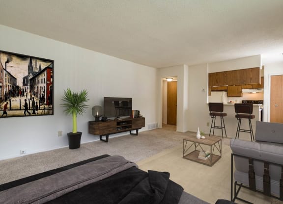 Larkspur Layout Living Room with Kitchen View at Lake in the Pines, Fayetteville 28311